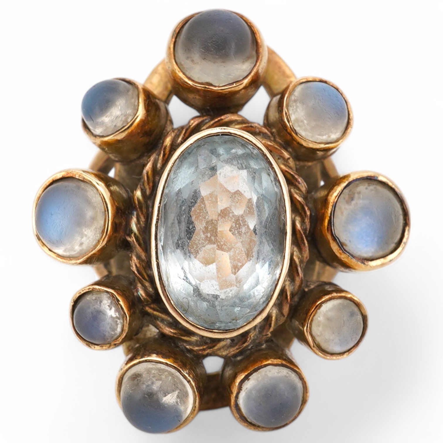 A yellow metal single stone aquamarine and nine stone cabochon moonstone set oval cluster ring, size R, gross weight 7.8grams Condition - poor to fair